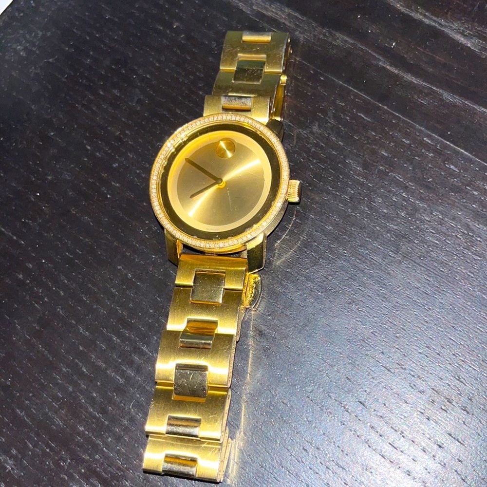 Contemporary gold Movado BOLD analog timepiece